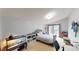 Bedroom with a slider door leading to a balcony, toys and carpet floor at 20023 Pergola Bend Ln, Tampa, FL 33647