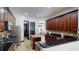 Kitchen featuring custom cabinets, stainless appliances, and island, with a view to the dining room at 20023 Pergola Bend Ln, Tampa, FL 33647