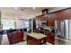 Well-equipped kitchen featuring an island, stainless steel appliances, and ample cabinet space at 20023 Pergola Bend Ln, Tampa, FL 33647