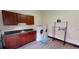 Bright laundry room with modern appliances, cabinetry, a utility sink, and space for folding and organizing at 20023 Pergola Bend Ln, Tampa, FL 33647