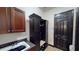 Functional mudroom with custom built-in cabinets, a utility sink, and convenient storage for shoes and coats at 20023 Pergola Bend Ln, Tampa, FL 33647