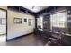 A home office that is complete with built-in shelving, storage and windows at 20023 Pergola Bend Ln, Tampa, FL 33647