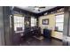 A home office that is complete with built-in shelving, storage and windows at 20023 Pergola Bend Ln, Tampa, FL 33647