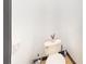 Neutral-toned bathroom with a standard toilet and stylish toilet paper holder at 20023 Pergola Bend Ln, Tampa, FL 33647