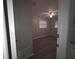Bedroom view featuring updated flooring, a ceiling fan, and a double window at 2045 Summit Dr, Dunedin, FL 34698