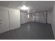 Spacious garage with freshly painted floors and walls with direct access to house at 2045 Summit Dr, Dunedin, FL 34698