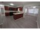 Modern kitchen featuring wood cabinets, a peninsula, and adjoining dining area at 2045 Summit Dr, Dunedin, FL 34698
