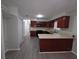 Spacious kitchen boasts wood cabinets, updated appliances, and ample counter space at 2045 Summit Dr, Dunedin, FL 34698