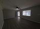 The living room has modern floors, a ceiling fan, and lots of natural light at 2045 Summit Dr, Dunedin, FL 34698