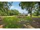 Expansive backyard featuring lush lawn and screened lanai, providing a serene outdoor retreat at 25238 Bunting Cir, Land O Lakes, FL 34639