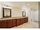Spacious bathroom with double vanities, granite countertops, and tile flooring at 25238 Bunting Cir, Land O Lakes, FL 34639