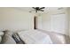 Bedroom with a ceiling fan, a closet, and a neutral color scheme, creating a serene retreat at 25238 Bunting Cir, Land O Lakes, FL 34639