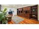 Cozy den with custom built-in wooden shelving and cabinets, offering ample storage and display space at 25238 Bunting Cir, Land O Lakes, FL 34639