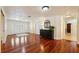 Spacious foyer featuring hardwood floors, elegant doors and trim, and tasteful decor, creating a welcoming entry at 25238 Bunting Cir, Land O Lakes, FL 34639
