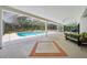 This screened lanai boasts a lounge area and a pool with spa, ideal for relaxing or entertaining at 25238 Bunting Cir, Land O Lakes, FL 34639