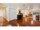 Bright and airy living area boasts hardwood flooring, with stylish furnishings and ample natural light at 25238 Bunting Cir, Land O Lakes, FL 34639
