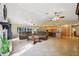 Bright open living area with tile flooring, connecting the living room and kitchen for seamless entertaining at 25238 Bunting Cir, Land O Lakes, FL 34639