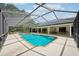 This screened pool area with spa and patio provides a private and enjoyable outdoor retreat at 25238 Bunting Cir, Land O Lakes, FL 34639