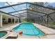 This yard features a pool with an attached spa and patio perfect for enjoying the outdoors at 25238 Bunting Cir, Land O Lakes, FL 34639