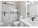 Bathroom featuring a glass enclosed shower with modern tiling and fixtures at 27209 Firebush Dr, Wesley Chapel, FL 33544