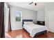 Bedroom featuring wood floors and a sliding glass door leading to the outside at 27209 Firebush Dr, Wesley Chapel, FL 33544