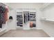 Walk-in closet with custom shelving and ample space for storage at 27209 Firebush Dr, Wesley Chapel, FL 33544