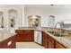 Kitchen with granite countertops, stainless steel appliances, and tiled floors at 27209 Firebush Dr, Wesley Chapel, FL 33544