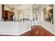 Spacious kitchen with granite countertops and stainless steel appliances and bar seating at 27209 Firebush Dr, Wesley Chapel, FL 33544
