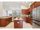 Modern kitchen with granite countertops, center island, stainless steel appliances, and ample cabinet space at 27209 Firebush Dr, Wesley Chapel, FL 33544