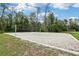 Sandy volleyball court is perfect for a fun day in the sun with friends and Gathering at 27209 Firebush Dr, Wesley Chapel, FL 33544