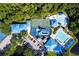 Aerial view of the community amenities featuring a pool, basketball court and waterpark area all with blue accents at 28390 Openfield Loop, Wesley Chapel, FL 33543