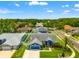 An aerial view of a home with a private pool and a well-manicured lawn at 28390 Openfield Loop, Wesley Chapel, FL 33543