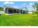 Well-manicured backyard and patio area are perfect for outdoor entertaining and grilling at 28390 Openfield Loop, Wesley Chapel, FL 33543