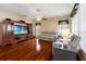 The living room has hardwood floors and a large entertainment center at 28390 Openfield Loop, Wesley Chapel, FL 33543