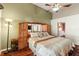 Inviting main bedroom featuring hardwood floors, a ceiling fan, and ensuite bathroom access at 28390 Openfield Loop, Wesley Chapel, FL 33543