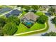 Aerial view of a screened-in pool and manicured lawn, perfect for outdoor enjoyment at 2847 Mossy Timber Trl, Valrico, FL 33596