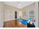 Bright bedroom with wood floors currently being used as an exercise room at 2847 Mossy Timber Trl, Valrico, FL 33596