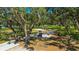 Picturesque community park featuring mature trees, a playground, and a bike rack in a natural setting at 2847 Mossy Timber Trl, Valrico, FL 33596