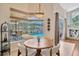 Bright breakfast nook with a view of the screened-in pool at 2847 Mossy Timber Trl, Valrico, FL 33596