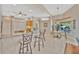 Breakfast bar looking into the dining area and kitchen with stainless steel appliances at 2847 Mossy Timber Trl, Valrico, FL 33596