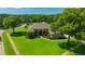 Beautiful single-story home featuring a well-manicured lawn, mature trees, and tasteful landscaping at 2847 Mossy Timber Trl, Valrico, FL 33596