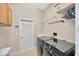 Well-equipped laundry room with modern washer and dryer and storage cabinets at 2847 Mossy Timber Trl, Valrico, FL 33596