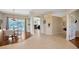 Open-concept living space with dining area, kitchen, and view of the pool area at 2847 Mossy Timber Trl, Valrico, FL 33596