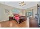 Well-lit main bedroom with wood floors and sliding glass door to pool at 2847 Mossy Timber Trl, Valrico, FL 33596