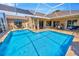 Large screened-in pool with outdoor lounge area at 2847 Mossy Timber Trl, Valrico, FL 33596