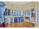 Large walk-in closet with ample hanging storage and shelving at 2847 Mossy Timber Trl, Valrico, FL 33596