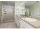 Bathroom featuring double sinks, a walk in shower, and vanity at 2876 Bayshore Trails Dr, Tampa, FL 33611