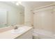 Well-lit bathroom with a single sink, bathtub, and shower, offering a clean and functional space at 2876 Bayshore Trails Dr, Tampa, FL 33611