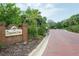 The Bayshore Trace community entrance sign provides a welcoming introduction to the neighborhood at 2876 Bayshore Trails Dr, Tampa, FL 33611