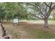 A view of Gadsden Park showcasing its wide open spaces, mature trees, and recreational opportunities at 2876 Bayshore Trails Dr, Tampa, FL 33611
